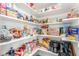 Pantry with shelves stocked with canned goods, snacks, and drinks at 386 Cactus River Ct, Henderson, NV 89052