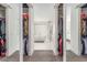 Walk-in closet with clothing racks and mirrored sliding doors, providing ample storage at 386 Cactus River Ct, Henderson, NV 89052