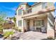 Outdoor living space with covered patio, ceiling fan, and landscaped backyard at 3925 Kettle Falls Ave, North Las Vegas, NV 89085