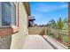 A sunny balcony with a privacy wall, space for plants, and views of the neighborhood at 3925 Kettle Falls Ave, North Las Vegas, NV 89085