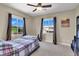 Bright bedroom with large windows, neutral carpet, and ample natural light at 3925 Kettle Falls Ave, North Las Vegas, NV 89085