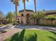 Beautiful stucco home with well-manicured lawn and elegant arched entryway at 3925 Kettle Falls Ave, North Las Vegas, NV 89085