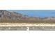 Wide shot of an open desert landscape in front of the property with scenic mountain views at 3925 Kettle Falls Ave, North Las Vegas, NV 89085