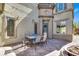 Cozy outdoor patio with brick flooring, a dining table, and string lights for added ambiance at 3925 Kettle Falls Ave, North Las Vegas, NV 89085