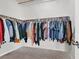 Large walk-in closet with clothing racks ready for organization and storage at 3925 Kettle Falls Ave, North Las Vegas, NV 89085