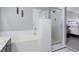 Bright bathroom featuring a tub and separate shower with clear glass doors and updated fixtures at 3950 S Sandhill Rd # 132, Las Vegas, NV 89121