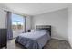 Comfortable bedroom with a large window and plush carpet flooring at 3950 S Sandhill Rd # 132, Las Vegas, NV 89121