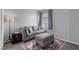 Cozy living room with a comfortable couch, ottoman and decorative rug at 3950 S Sandhill Rd # 132, Las Vegas, NV 89121