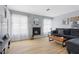 Cozy living room featuring a fireplace, neutral tones, and wood-look floors at 3950 S Sandhill Rd # 132, Las Vegas, NV 89121