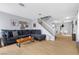 Open living room with comfortable seating, stylish decor, and staircase at 3950 S Sandhill Rd # 132, Las Vegas, NV 89121