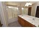 Spacious bathroom offering double sinks, a bathtub, and a glass-enclosed shower at 41 Rosa Rosales Ct, North Las Vegas, NV 89031