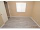 Cozy bedroom featuring wood-look flooring and a standard window at 41 Rosa Rosales Ct, North Las Vegas, NV 89031
