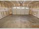 Spacious two-car garage with painted walls and a white garage door at 41 Rosa Rosales Ct, North Las Vegas, NV 89031