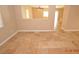 Living room featuring tile floors and an open view to the kitchen at 41 Rosa Rosales Ct, North Las Vegas, NV 89031