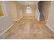 Open living room featuring tile flooring, stairway, and neutral paint at 41 Rosa Rosales Ct, North Las Vegas, NV 89031