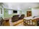 Bonus room with bed, seating, bookshelf, and bright walls featuring tile flooring at 4795 W Maulding Ave, Las Vegas, NV 89139