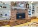 Charming brick fireplace with custom built-in shelves, a focal point in this cozy living space at 4795 W Maulding Ave, Las Vegas, NV 89139