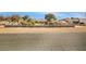 Wide front exterior view of home, featuring a decorative block fence, foliage and xeriscaping at 4795 W Maulding Ave, Las Vegas, NV 89139