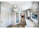 Hallway with tile floors and doors to a dining room and outdoor patio at 4795 W Maulding Ave, Las Vegas, NV 89139