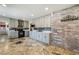 Updated kitchen featuring quartz counters, gray cabinetry, and stainless steel appliances at 4795 W Maulding Ave, Las Vegas, NV 89139