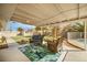Covered patio with outdoor furniture and a view of the spacious backyard at 4795 W Maulding Ave, Las Vegas, NV 89139