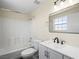 Bathroom featuring shower-tub combination with a window and modern vanity at 5330 E Charleston Blvd # 116, Las Vegas, NV 89142