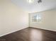 Bedroom featuring wood floor, natural light from the window, and neutral paint at 5330 E Charleston Blvd # 116, Las Vegas, NV 89142