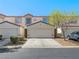 Well-maintained townhome features a private garage and low-maintenance landscaping in a desirable community at 5330 E Charleston Blvd # 116, Las Vegas, NV 89142