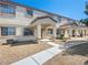 Inviting townhome showcasing covered entrances and desert landscaping for low maintenance living at 5330 E Charleston Blvd # 116, Las Vegas, NV 89142