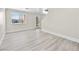 Open living area featuring modern gray vinyl flooring, and bright natural light at 5330 E Charleston Blvd # 116, Las Vegas, NV 89142