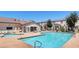 Community pool and spa area with lounge chairs and well-maintained landscaping against building at 5330 E Charleston Blvd # 116, Las Vegas, NV 89142