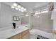 Clean bathroom featuring a shower-tub combo, white vanity, and chrome hardware, with functional and stylish design at 5332 Desert Blossom Rd, Las Vegas, NV 89107