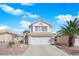 Charming two-story home featuring a desert landscape and a two car garage at 5332 Desert Blossom Rd, Las Vegas, NV 89107