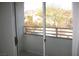 Balcony view of neighborhood landscape with natural sunlight and sliding glass door at 5650 E Sahara Ave # 2041, Las Vegas, NV 89142