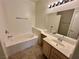 Bathroom featuring a large tub and single sink vanity, perfect for a relaxing home at 5650 E Sahara Ave # 2041, Las Vegas, NV 89142