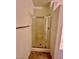 Bathroom with a glass shower, neutral walls and floors, plus towel rack at 5650 E Sahara Ave # 2041, Las Vegas, NV 89142