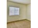 Cozy bedroom featuring a window with blinds and carpeted floor at 5650 E Sahara Ave # 2041, Las Vegas, NV 89142