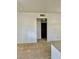 Neutral living room showcasing carpet, white walls, and doorway to bathroom at 5650 E Sahara Ave # 2041, Las Vegas, NV 89142