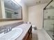Bathroom featuring granite countertops, modern vanity, and glass-enclosed shower at 6250 W Flamingo Rd # 11, Las Vegas, NV 89103