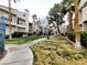 Serene community grounds feature lush greenery, mature trees, and walkways for residents' enjoyment at 6250 W Flamingo Rd # 11, Las Vegas, NV 89103