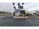 Community entrance sign framed by tall palm trees, creating a welcoming tropical atmosphere at 6250 W Flamingo Rd # 11, Las Vegas, NV 89103