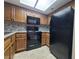 Bright kitchen featuring updated appliances, stone tile backsplash, and tile floors at 6250 W Flamingo Rd # 11, Las Vegas, NV 89103