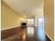Spacious living room featuring wood floors, a fireplace, and natural light at 6250 W Flamingo Rd # 11, Las Vegas, NV 89103