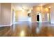 Expansive living area with hardwood floors, easy access to the kitchen, and bright sliding glass doors at 6250 W Flamingo Rd # 11, Las Vegas, NV 89103