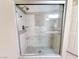 Modern walk-in shower featuring tiled walls, glass doors, and sleek fixtures at 6250 W Flamingo Rd # 11, Las Vegas, NV 89103