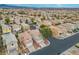 Aerial view of a two-story home in a residential neighborhood with tree-lined streets at 6429 Pronghorn Ridge Ave, Las Vegas, NV 89122