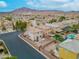 Aerial view of neighborhood with pool and mountain views at 6429 Pronghorn Ridge Ave, Las Vegas, NV 89122