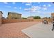 Spacious backyard with gravel, patio, and block wall at 6429 Pronghorn Ridge Ave, Las Vegas, NV 89122