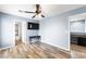 Open and airy bedroom with ensuite bath, ceiling fan, and wood-look floors at 6429 Pronghorn Ridge Ave, Las Vegas, NV 89122