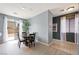 Cozy dining area with sliding glass doors, blending indoor/outdoor living with natural light and backyard access at 6429 Pronghorn Ridge Ave, Las Vegas, NV 89122